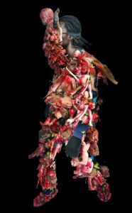 Shaka : A travers ces eouvres, Shaka tente de mélanger art tribal et ancestrales à une nouvelle vision du monde via l'utilisation de matériel recyclé. Une tentative de réconciliation en passé et présent.

dans cette performance, Shaka dénonce les situations de guerre tribales dans l’est du congo à travers des poupées rouge sang. Shaka a notamment subit l'une de ces guerres.