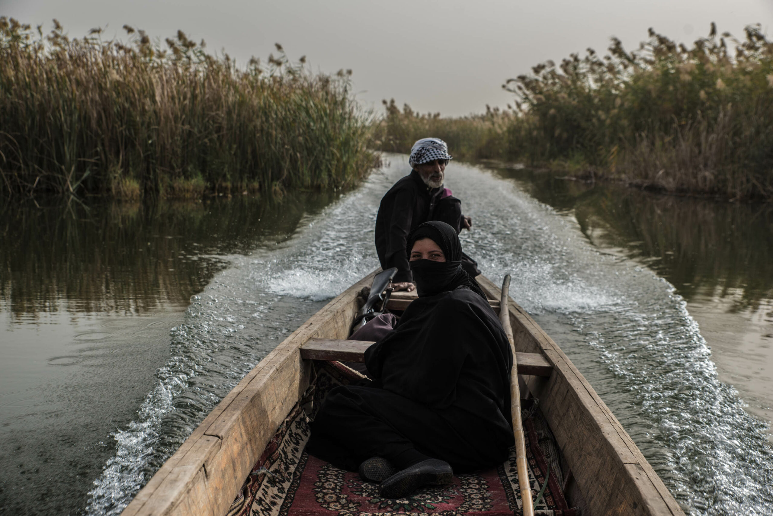 Abu Haidar and Oum Haidar in their boat in the Central Marsh.