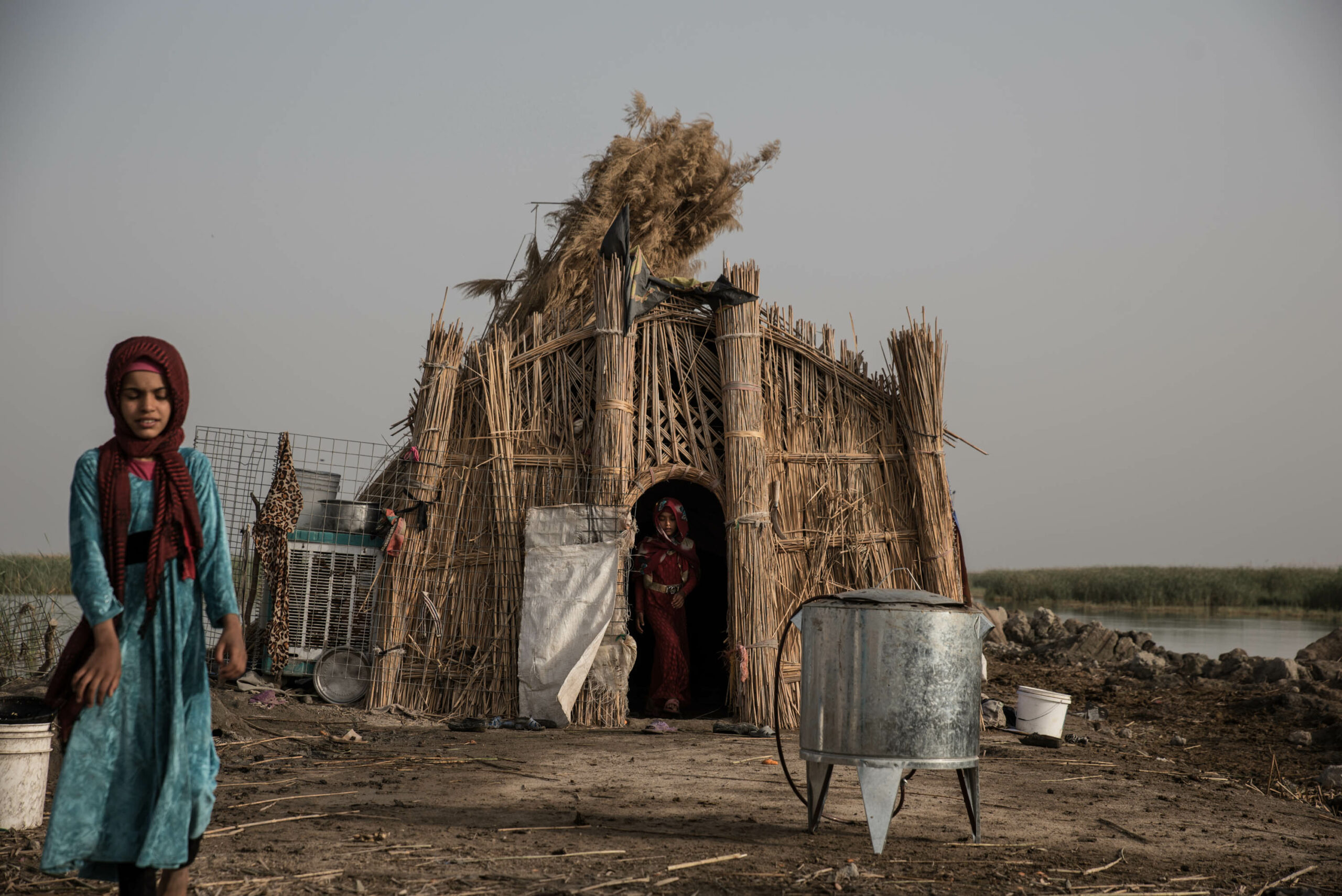 Sayeed Ali's daughters, Inas and Banin, are coming out of the house in the early morning. They are not older than 11 years old but already wear a hijab. None goes to school.
