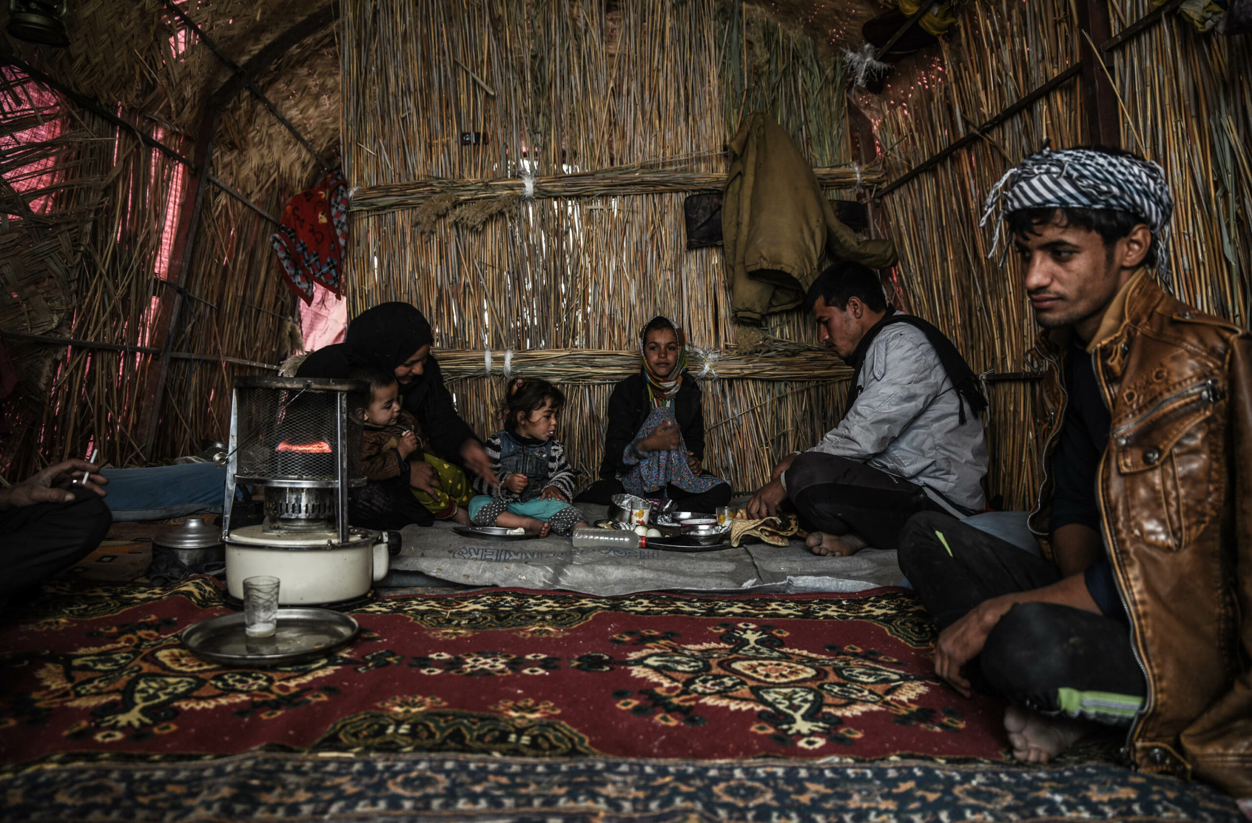 Sayeed Ali's older brother, Haidar, is having breakfast with his family in their house in Ishan Gubba, Central Marsh.